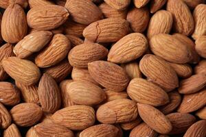 Closeup of almond, nut food, brown almonds photo