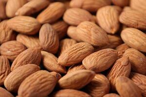 Closeup of almond, nut food, brown almonds photo