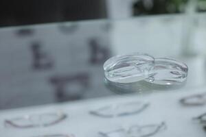 Glasses lenses on the table in optic, eyeglasses lenses photo