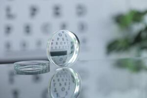 Glasses lenses on the table in optic, eyeglasses lenses photo