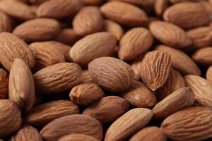 Closeup of almond, nut food, brown almonds photo