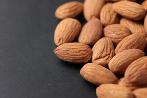 Closeup of almond, nut food, brown almonds photo