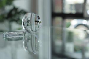 Glasses lenses on the table in optic, eyeglasses lenses photo