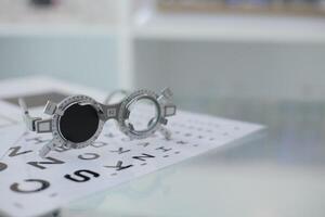 Trial frame eye test, eye exam Phoropter, glasses lenses eye check photo