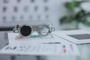 Trial frame eye test, eye exam Phoropter, glasses lenses eye check photo