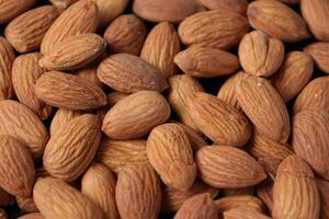 Closeup of almond, nut food, brown almonds photo