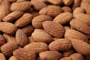 Closeup of almond, nut food, brown almonds photo