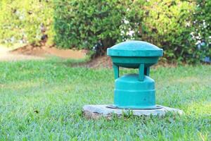 Classic Loudspeaker on cement floor in the lawn of the park. photo