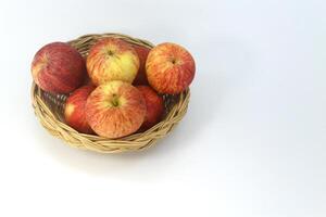 Apples in the basket isolated on white background. photo