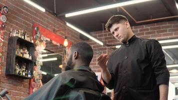 Hairdresser cuts the client's hair with scissors. Man in the barbershop. The profession of hairdresser video