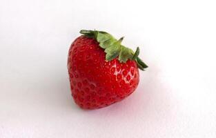 Fresh strawberry fruit isolated on white paper background. photo