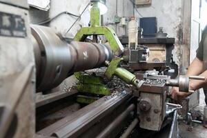 metalworking from a manual bench lathe machine photo