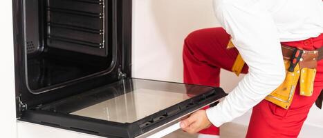 man assembling an electric oven photo