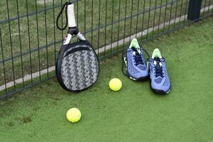 Paddle tennis and artificial grass, close up image photo