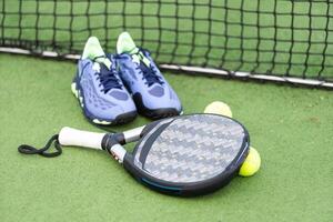 Paddle tennis and artificial grass, close up image photo