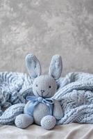 AI generated Gray vertical background with blue plush toy and copy space. It's a boy backdrop with empty space for text. Baby shower or birthday invitation, party. Baby boy birth announcement photo