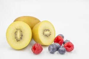 Kiwi Blueberry and Raspberry White Background. Diet for weight loss. Vegetarian food. photo