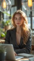 ai generado joven mujer en un negro negocio traje con un gris computadora portátil, en el oficina se sienta a un adicional mesa en cuales allí es un planta de casa. moderno oficina en ligero colores foto