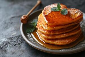 AI generated stack of heart-shaped pancakes with honey on a plate. View from above. Served on the kitchen table for breakfast photo