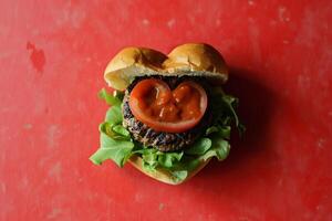 AI generated Homemade heart shaped hamburger with beef, tomato and lettuce on wooden background photo