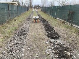 Construction of road filling with gravel photo