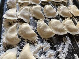 Dumplings made from dough with potato filling photo