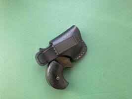 Revolver with holster for concealed carry of weapons photo
