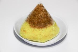 Spicy sticky rice serundeng is a traditional Indonesian food that is often eaten as breakfast or snacks or to break the fast. Made from steamed sticky rice and sprinkled with spicy or sweet serundeng photo