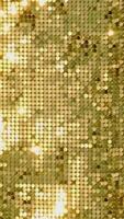 vertical video of rows of blinking golden yellow brass metal plaques sway in wind and shines in sun and create unique pattern of movement. round reflective particles glitter under waves of wind