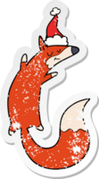 hand drawn distressed sticker cartoon of a jumping fox wearing santa hat png
