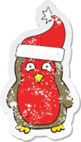 retro distressed sticker of a cartoon christmas robin wearing santa hat png