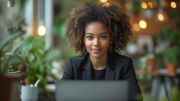 AI generated Young woman in a black business suit with a gray laptop, in the office sits at an additional table on which there is a houseplant. Modern office in light colours photo