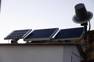 Point Arena, CA, 2013 - Three Solar Panels Powering Outdoor Lighting Building photo