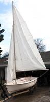 Carmichael, CA, 2012 - Old Small Sailboat With Sails Up In Driveway photo