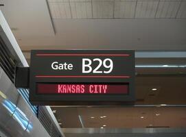 Airport Gate Sign For Kansas City With Ceiling Background photo