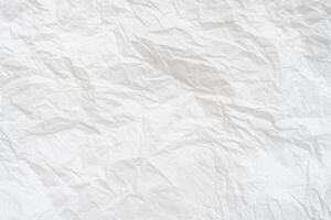 Wrinkled or crumpled white stencil paper or tissue paper after use with large copy space used for background texture photo