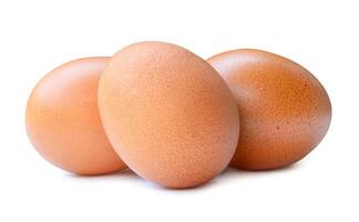 Front view of fresh chicken eggs in stack isolated on white background with clipping path photo