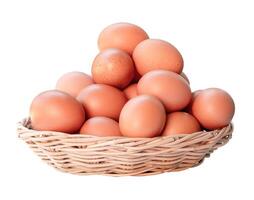 Front view of fresh chicken eggs in woven bamboo basket isolated on white background with clipping path photo