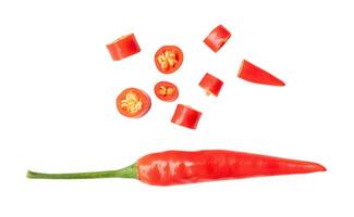 Top view of single fresh red chili pepper with slices isolated on white background with clipping path photo