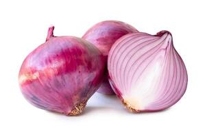 Front view of red or purple onion bulb with half in stack isolated on white background with clipping path photo