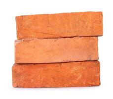 Side view of old red or orange bricks in stack isolated on white background with clipping path photo