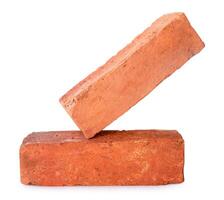 Side view of old red or orange bricks in stack isolated on white background with clipping path photo