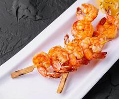 Grilled Shrimp Scampi Skewers with lemon photo