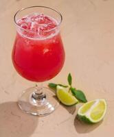 Cold summer strawberry cocktail with lime photo