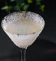 martini glasses of coconut alcohol drink closeup photo