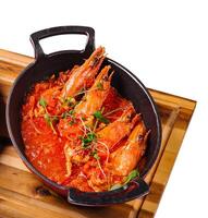 freshly cooked prawns in spicy tomato sauce photo