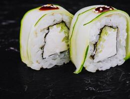 Sushi set with cheese, rice and cucumber photo