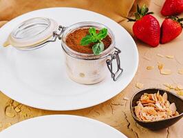 tiramisu in a glass jar top view photo