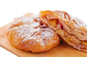 Baking puff pastry vertuta with apple or strudel photo