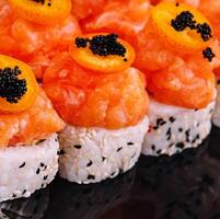 Maki Sushi - Roll topped with Sliced Spicy Salmon photo